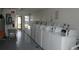 Bright laundry room featuring multiple white washing machines for resident convenience at 5434 Chad Pl # 14, New Port Richey, FL 34652