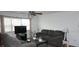 A living room with large window and comfortable gray sofa at 5434 Chad Pl # 14, New Port Richey, FL 34652
