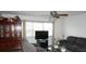 A living room with large window and comfortable gray sofa at 5434 Chad Pl # 14, New Port Richey, FL 34652