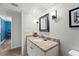 Bathroom with a granite vanity and contemporary light fixtures at 5502 Bluejay Ln, Tampa, FL 33625