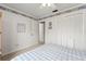 Bright bedroom with wainscoting, closet access and floral trim ceiling at 5502 Bluejay Ln, Tampa, FL 33625