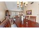 Open-concept dining area with chandelier, dining table, and seamless flow into the adjacent living space at 5502 Bluejay Ln, Tampa, FL 33625
