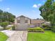Charming two-story home with well-manicured lawn and a two-car garage on a sunny day at 5502 Bluejay Ln, Tampa, FL 33625