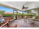 Screened-in patio overlooking the pool and backyard of the home at 5502 Bluejay Ln, Tampa, FL 33625