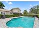 Beautiful pool area with well-maintained landscaping surrounding the home at 5502 Bluejay Ln, Tampa, FL 33625