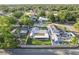 Aerial view of the property showcasing its well-manicured lawn and established trees, within a residential neighborhood at 5520 Fulmar Dr, Tampa, FL 33625
