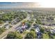 Aerial view of the property highlighting its location with mature trees in a beautiful residential neighborhood at 5520 Fulmar Dr, Tampa, FL 33625