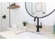 Modern bathroom boasts stylish vanity with marble countertop and elegant matte black faucet at 5520 Fulmar Dr, Tampa, FL 33625