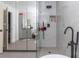 Luxurious bathroom featuring a glass shower, updated vanity and modern fixtures with a neutral color palette at 5520 Fulmar Dr, Tampa, FL 33625