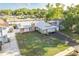 Inviting single-story home boasts a stone chimney and freshly cut green lawn at 5520 Fulmar Dr, Tampa, FL 33625
