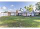 A well-manicured lawn and stone accents add curb appeal to this lovely home at 5520 Fulmar Dr, Tampa, FL 33625