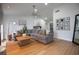 Stylish living room with modern decor, wood flooring, and a comfortable gray sectional couch at 5520 Fulmar Dr, Tampa, FL 33625