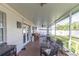 Covered outdoor space offering ample seating and a spot for grilling and entertaining at 5520 Fulmar Dr, Tampa, FL 33625
