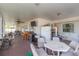 Spacious screened patio with furniture, bar, TV, and appliances for outdoor entertaining at 5520 Fulmar Dr, Tampa, FL 33625