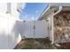A white vinyl gate provides access to the side yard at 5520 Fulmar Dr, Tampa, FL 33625