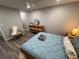 Comfortable bedroom featuring stylish furnishings, soft lighting, and wood flooring at 5555 Gulf Blvd # 315, St Pete Beach, FL 33706