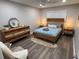 Bedroom features stylish wood furnishings, soft lighting, and wood flooring at 5555 Gulf Blvd # 315, St Pete Beach, FL 33706