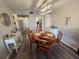 Charming dining area featuring a round wooden table and seating for four with access to the kitchen at 5555 Gulf Blvd # 315, St Pete Beach, FL 33706