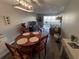 Bright living room features modern furnishings, balcony access and wood flooring at 5555 Gulf Blvd # 315, St Pete Beach, FL 33706