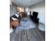 Cozy living room features wood floors, area rug, and comfortable furniture at 5555 Gulf Blvd # 315, St Pete Beach, FL 33706