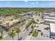 Street view featuring businesses, sidewalks lined with palm trees, and ample parking at 5724 Casson Ave, New Port Richey, FL 34652