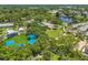 Picturesque aerial shot highlighting a park with green spaces, a stage, and recreational facilities at 5724 Casson Ave, New Port Richey, FL 34652