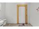 Unfinished basement space with access door perfect for storage or customization at 5724 Casson Ave, New Port Richey, FL 34652