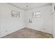 Unfinished basement featuring natural light through windows and ample space for renovation at 5724 Casson Ave, New Port Richey, FL 34652