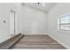 Bedroom with a ceiling fan, neutral walls, laminate floors, and natural light at 5724 Casson Ave, New Port Richey, FL 34652