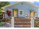 Attractive light blue home with prominent address number and a decorative front garden at 5724 Casson Ave, New Port Richey, FL 34652