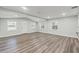 An inviting, newly remodeled living room with fresh paint, modern floors, and lots of natural light at 5724 Casson Ave, New Port Richey, FL 34652
