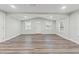 Bright living room with modern floors, freshly painted, flooded with natural light from multiple windows at 5724 Casson Ave, New Port Richey, FL 34652