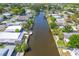 Aerial view of the canal-front neighborhood with lush greenery and waterfront homes at 5824 Portsmouth Dr, Tampa, FL 33615