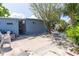 Backyard oasis with a mature shade tree and relaxing patio seating area at 5824 Portsmouth Dr, Tampa, FL 33615