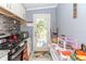 Functional kitchen featuring stainless steel appliances and access to the outdoors through the back door at 5824 Portsmouth Dr, Tampa, FL 33615