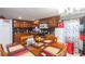Inviting kitchen and dining area with warm wood cabinets, offering a welcoming gathering space at 5824 Portsmouth Dr, Tampa, FL 33615