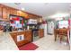 Well-lit kitchen with updated appliances, granite countertops, and a cozy dining area at 5824 Portsmouth Dr, Tampa, FL 33615
