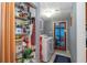 Laundry room featuring a washer, dryer, ample shelving and easy backyard access at 5824 Portsmouth Dr, Tampa, FL 33615