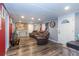 Cozy living room with hardwood floors, comfortable seating, and natural light at 5824 Portsmouth Dr, Tampa, FL 33615