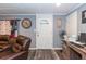 Home office area featuring a desk, leather chair, and a door leading to another room at 5824 Portsmouth Dr, Tampa, FL 33615