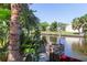 Scenic waterfront view from the property featuring a canal, lush greenery, and serene atmosphere at 5824 Portsmouth Dr, Tampa, FL 33615