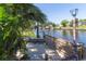 Waterfront property with a fenced patio area for enjoying scenic canal views and peaceful surroundings at 5824 Portsmouth Dr, Tampa, FL 33615