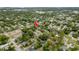 Aerial view of the property and neighborhood featuring mature trees and well-maintained homes at 6019 Wyoming Ave, New Port Richey, FL 34653
