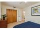 Bright bedroom featuring tile floors, ceiling fan and convenient access to an ensuite bathroom at 6019 Wyoming Ave, New Port Richey, FL 34653