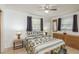 Comfortable bedroom with stylish bedding and a natural wood dresser at 6019 Wyoming Ave, New Port Richey, FL 34653