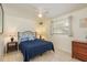 Comfortable bedroom with neutral walls, ceiling fan, and ample natural light at 6019 Wyoming Ave, New Port Richey, FL 34653