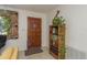 Cozy entryway featuring tile floors, decorative touches, and a warm, inviting atmosphere at 6019 Wyoming Ave, New Port Richey, FL 34653