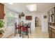 Eat-in kitchen with large window and adjacent office at 6019 Wyoming Ave, New Port Richey, FL 34653