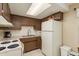 Functional kitchen space with white appliances and ample counter space at 6019 Wyoming Ave, New Port Richey, FL 34653