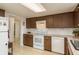 Open kitchen featuring updated appliances and lots of cabinet space at 6019 Wyoming Ave, New Port Richey, FL 34653